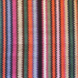 Handwoven wool striped rug in bright colors. 