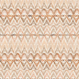 Detail of fabric in a painterly ikat print in shades of tan and orange on a white field.