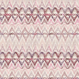Detail of fabric in a painterly ikat print in shades of purple and pink on a white field.