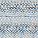 Detail of wallpaper in a painterly ikat print in shades of blue and navy on a white field.