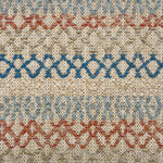 Handwoven rug detail in a lattice stripe design in blue, rust red, sage green and tan. 