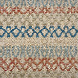 Handwoven rug detail in a lattice stripe design in blue, rust red, sage green and tan. 