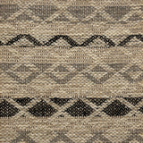 Handwoven rug detail in a lattice stripe design in black and grey
