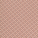 Detail of woven fabric in a geometric grid print in red and navy on a cream field.