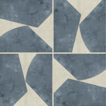 Detail of wallpaper in a geometric grid print in blue-gray on a mottled cream field.