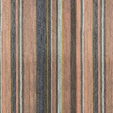 Detail of wallpaper in an irregular stripe print in shades of brown, pink, navy and turquoise.
