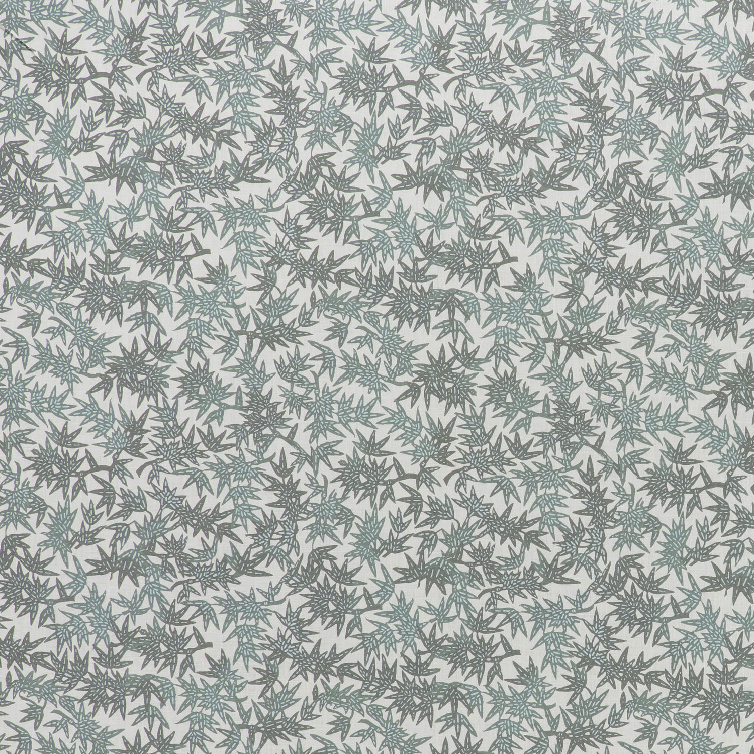 Printed linen fabric in a repeating bamboo leaf pattern in shades of green on a white field.