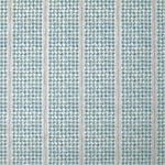 Detail of fabric in a dense repeating stripe and star print in blue on a cream field.