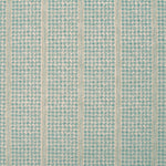 Detail of fabric in a dense repeating stripe and star print in turquoise on a tan field.