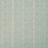 Detail of fabric in a dense repeating stripe and star print in turquoise on a tan field.