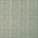 Detail of fabric in a dense repeating stripe and star print in green on a tan field.