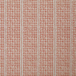 Detail of fabric in a dense repeating stripe and star print in red on a cream field.