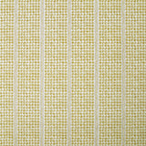 Detail of fabric in a dense repeating stripe and star print in mustard on a cream field.