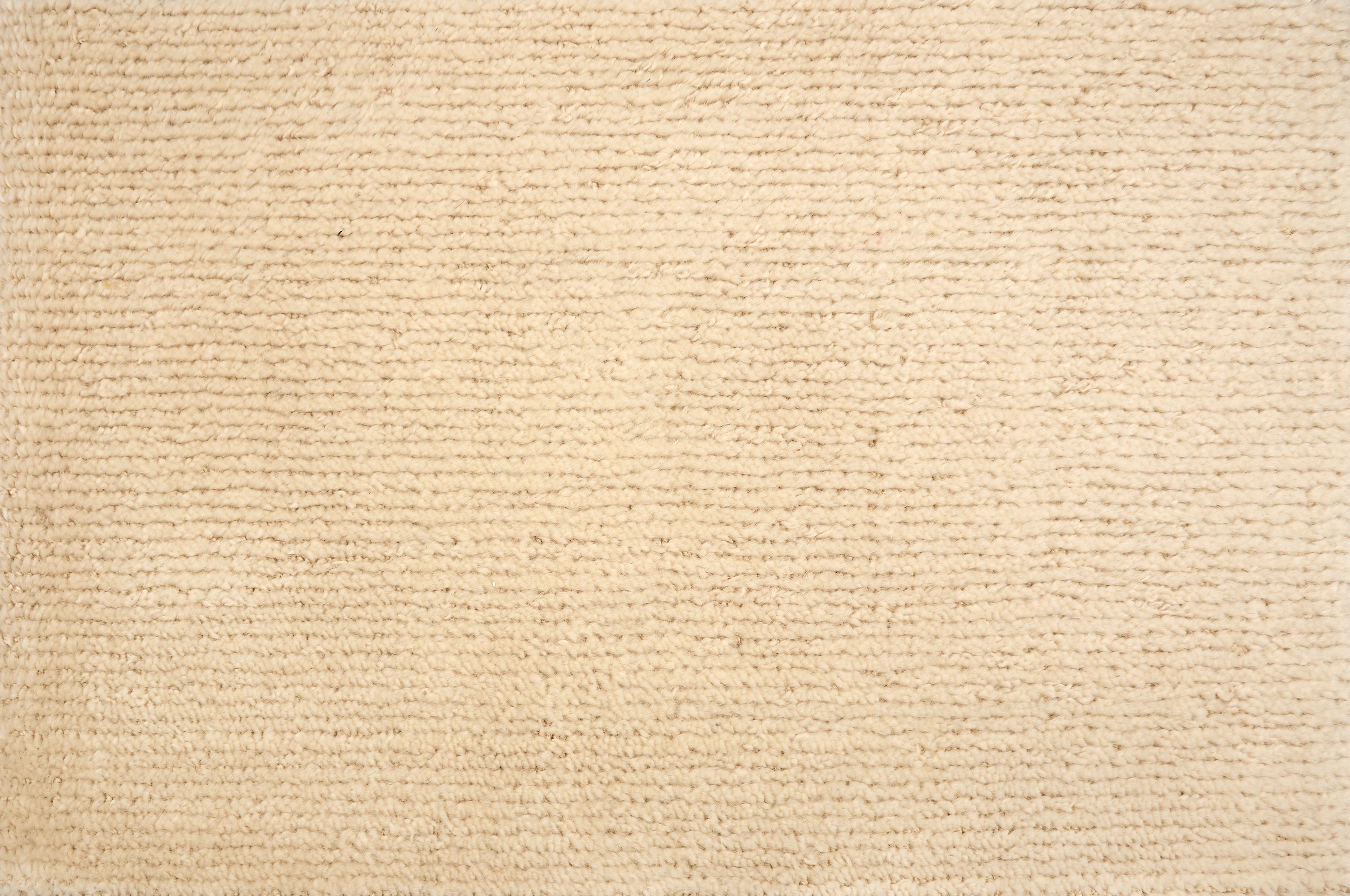 Broadloom carpet solid ribbed cut pile in ivory. 
