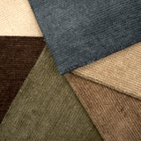Group of solid luxe broadloom carpets in rich colors. 