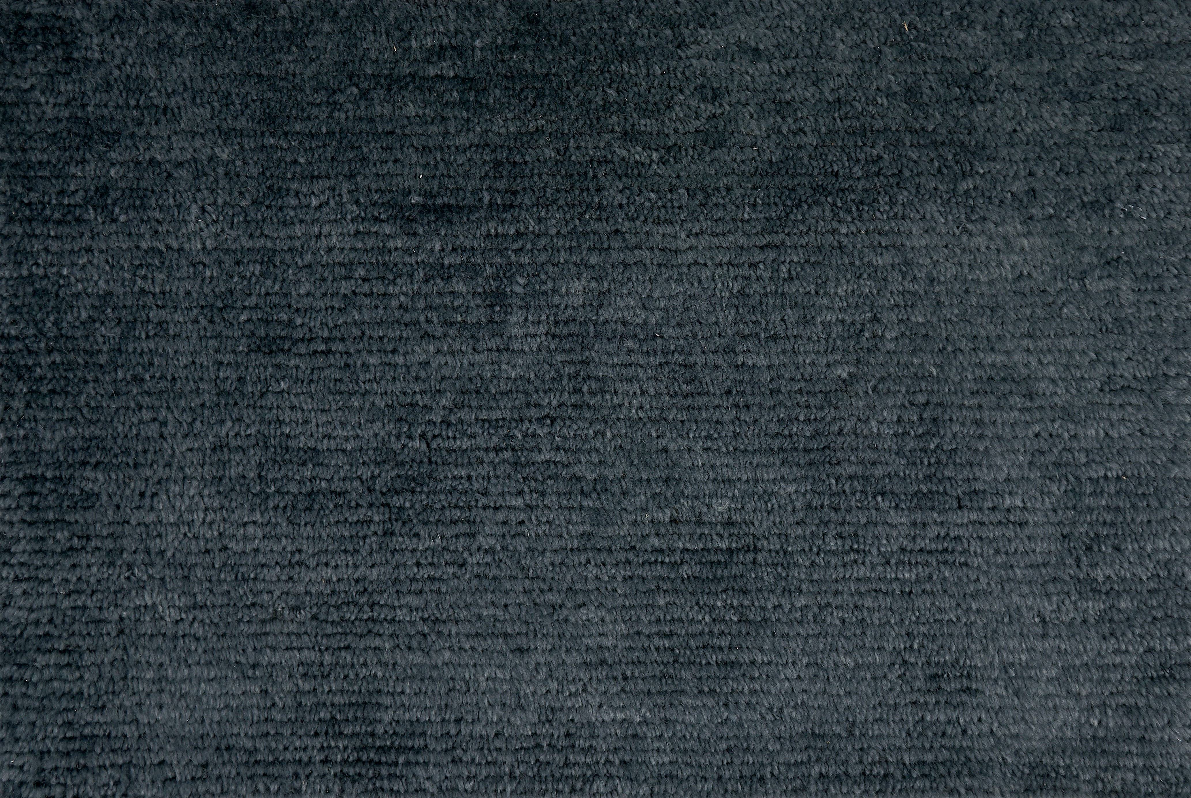 Broadloom carpet solid ribbed cut pile in navy blue. 