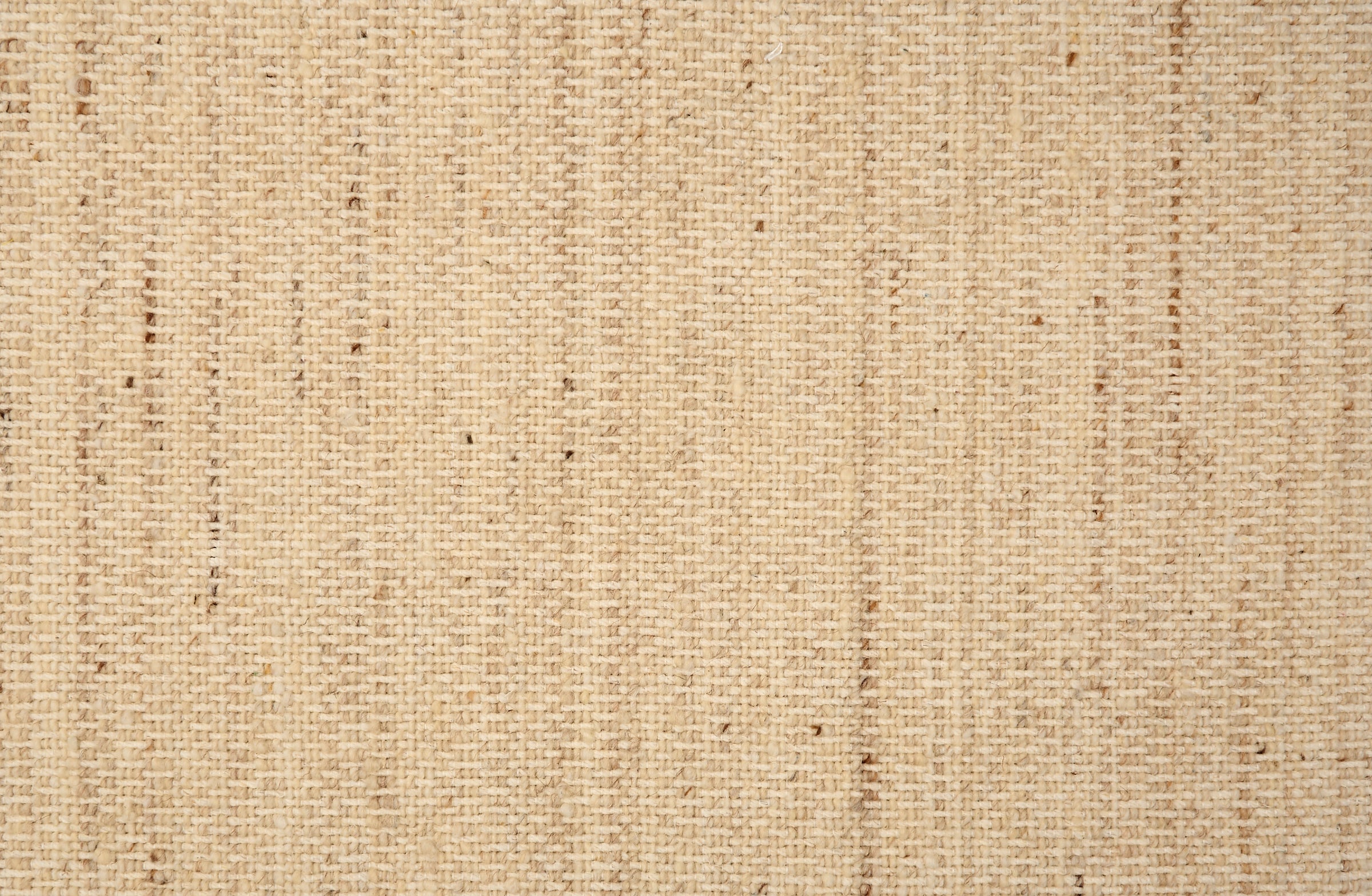 Textural strié broadloom in shades of warm beige.