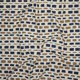 Close up of printed linen with graphic plaid pattern in shades of brown, tan, light and navy blue