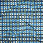 A close-up of a woven fabric pattern featuring intersecting vertical and horizontal stripes in navy blue, medium blue, light blue, olive green, and white.
