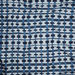 Close up of gently draped woven Indoor-Outdoor fabric with graphic plaid pattern in shades of light and dark blue with white. 