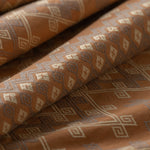 Brown fabric with geometric pattern lightly folded