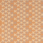 Patterned fabric with geometric design on a tan background