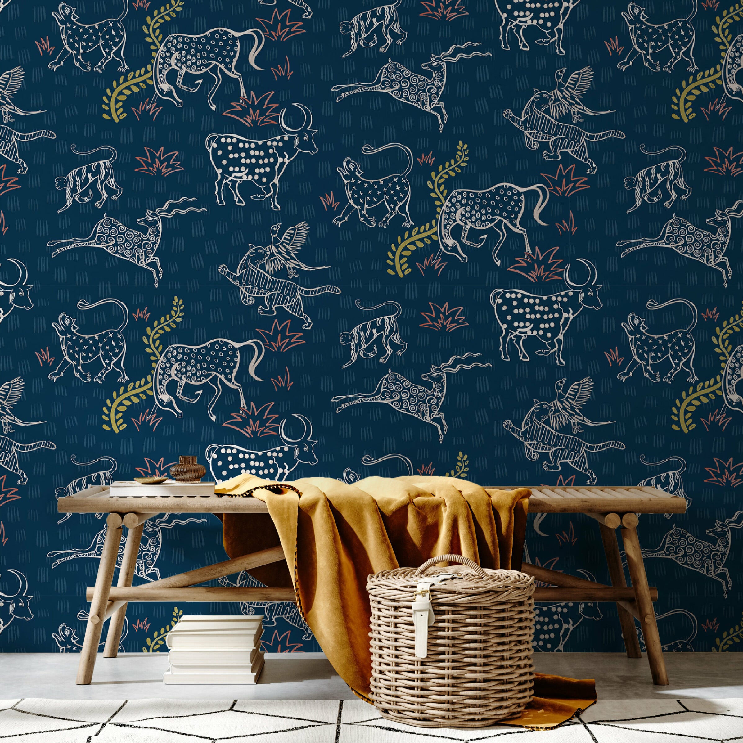 A bench and basket stand in front of a wall papered in a playful hand-drawn animal print in shades of white, pink and navy.