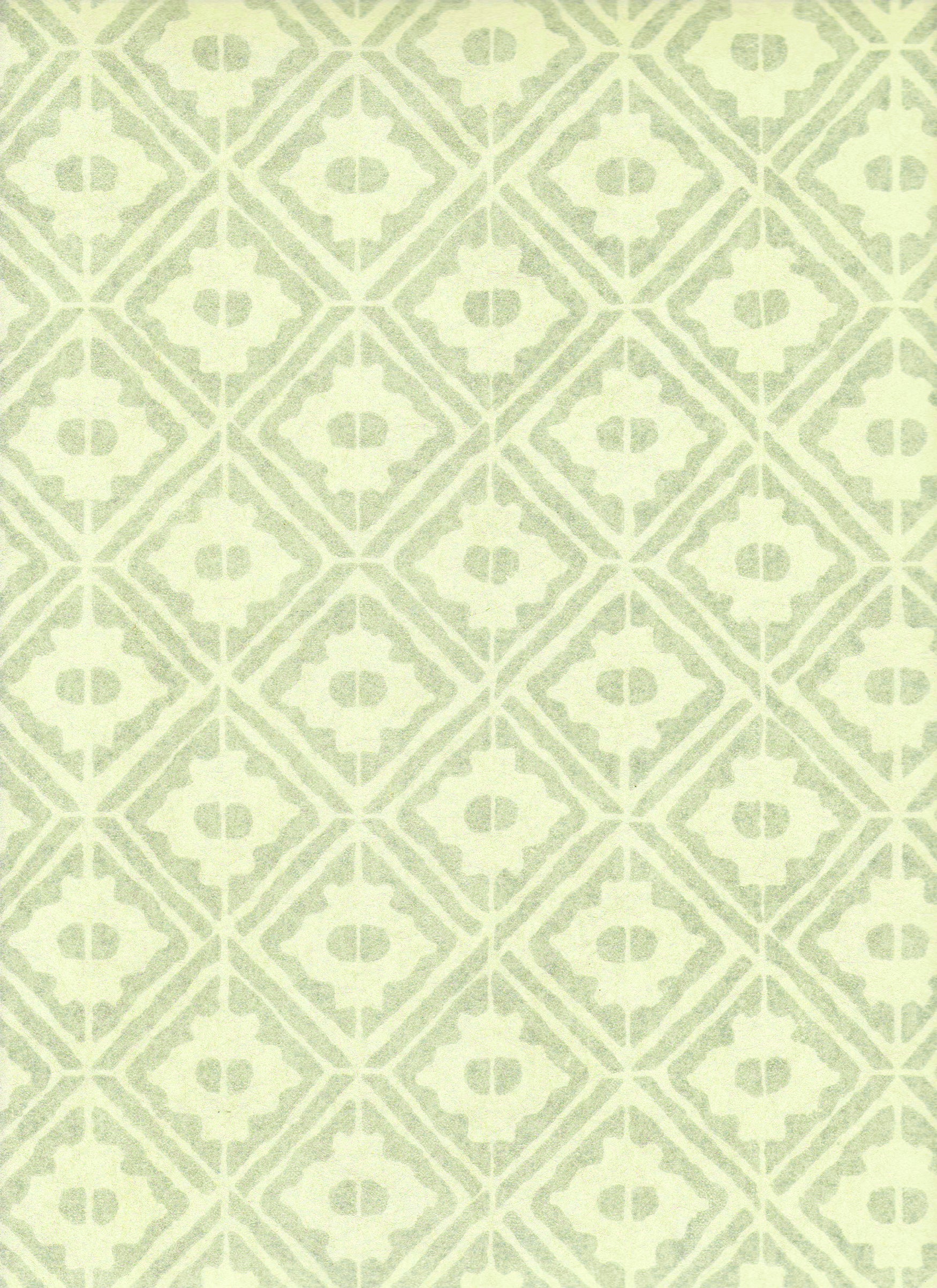 Detail of wallpaper in a geometric lattice print in shades of green.