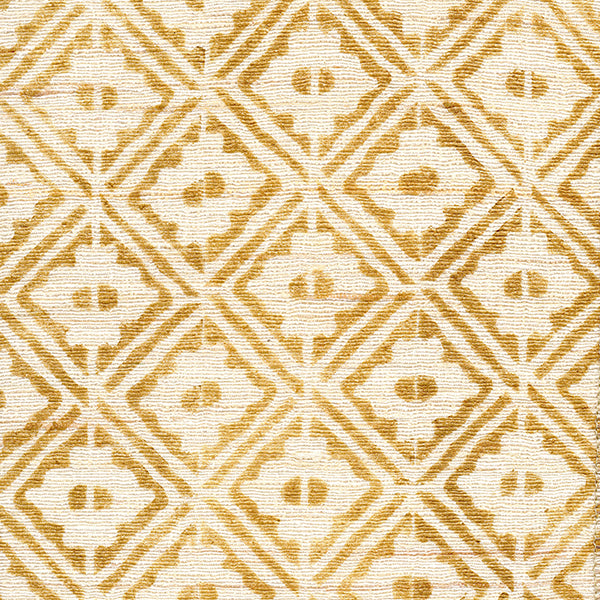 Detail of fabric in a geometric lattice grid in orange on a cream field.