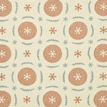 Detail of fabric in a repeating berry and leaf pattern in orange and green on a tan field.