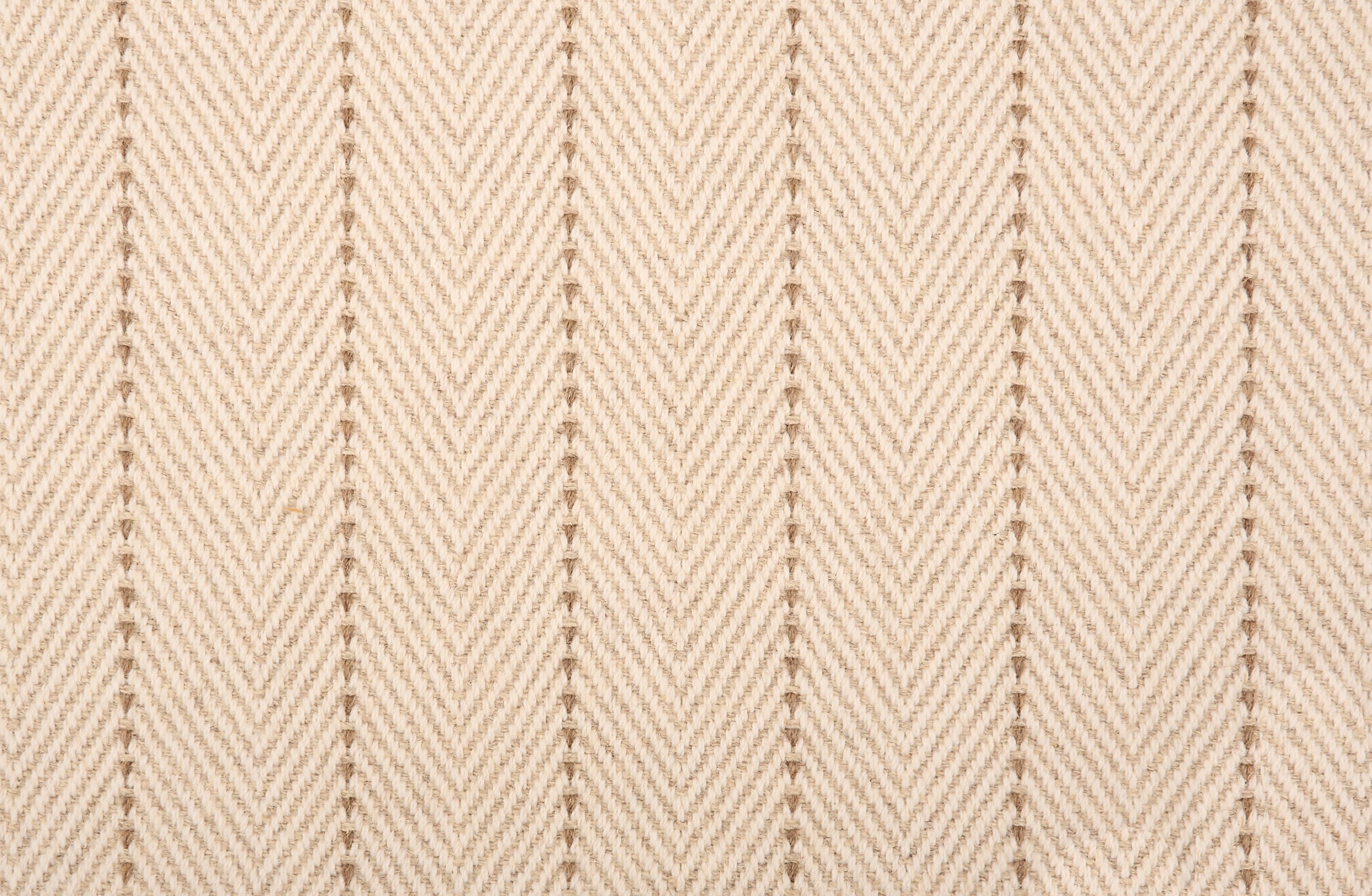 Broadloom carpet in a herringbone pattern in ecru with a tan stripe accent.