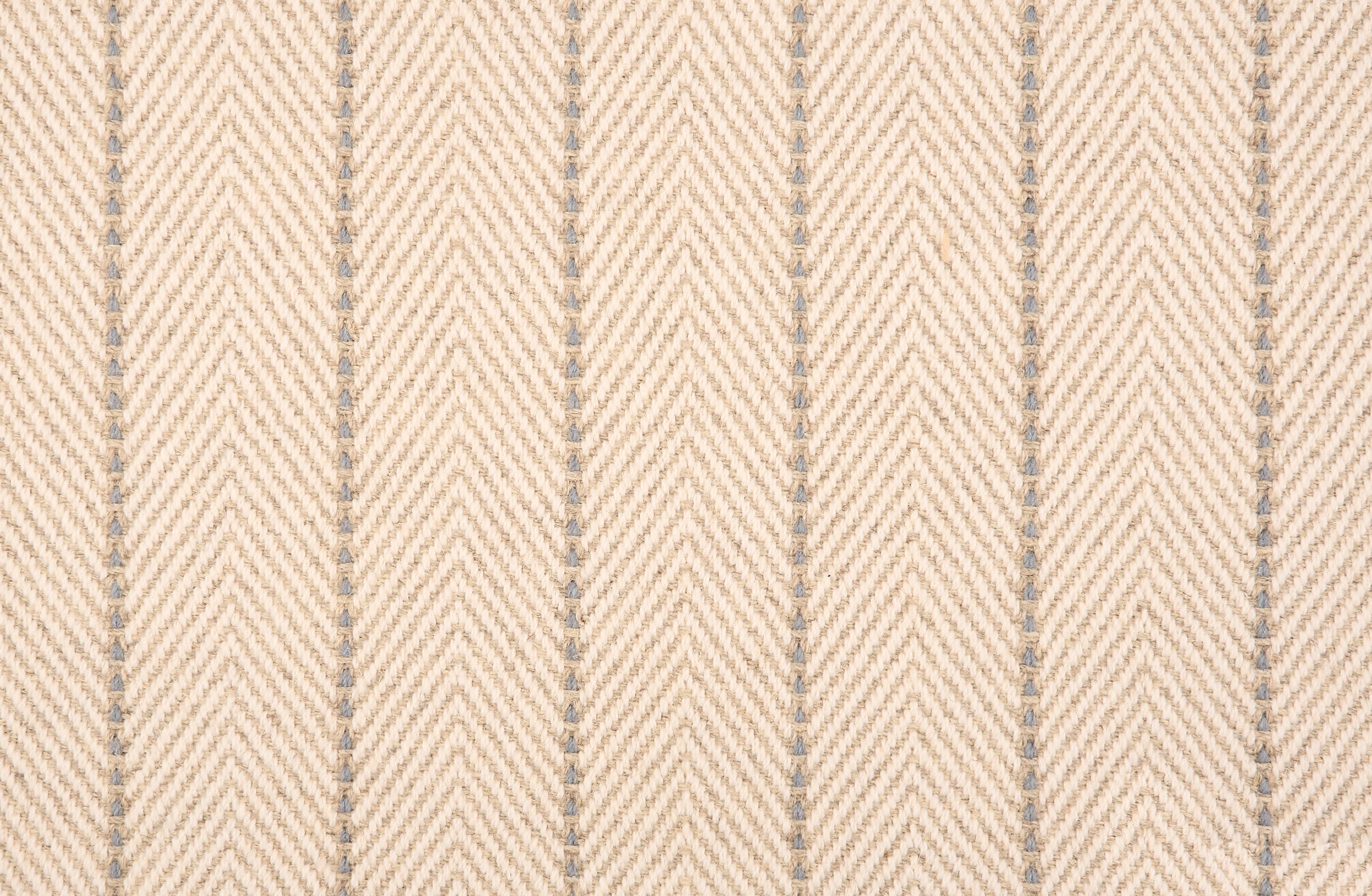 Broadloom carpet in a herringbone pattern in beige with a grey stripe accent.