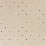 Printed linen fabric in a repeating small-scale flower pattern in navy on a cream field.