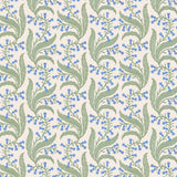 Wallpaper in a scrolling floral pattern in blue and green on a cream field. 