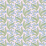 Wallpaper in a scrolling floral pattern in blue and green on a pink field. 