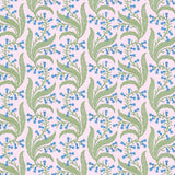 Wallpaper in a scrolling floral pattern in blue and green on a pink field. 