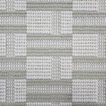Broadloom carpet in a complex checkerboard pattern in ivory and pastel sage green.
