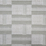 Broadloom carpet in a complex checkerboard pattern in ivory and pastel sage green.