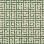 Detail of fabric in a circular floral print in light green and white on a mottled green field.