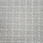 Close-up of a carpet with a textured check pattern in beige and white.