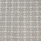 Close-up of a carpet with a textured check pattern in grey and white.