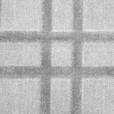 Broadloom carpet in a dimensional plaid pattern in silver grey.