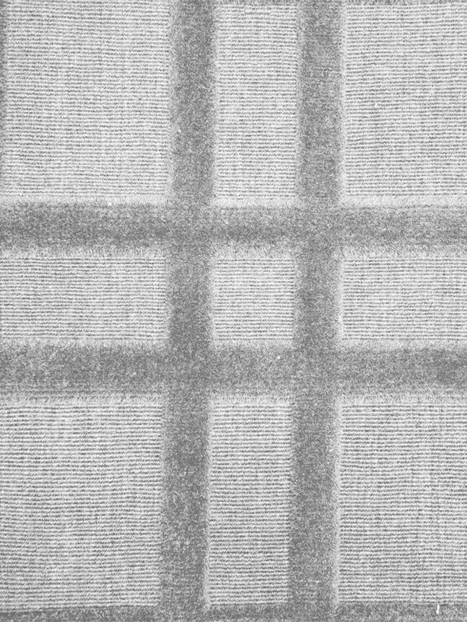 Broadloom carpet in a dimensional plaid pattern in silver grey.