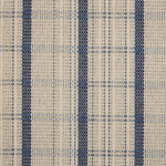 Broadloom carpet in a windowpane plaid in cream and blue.