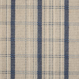 Broadloom carpet in a windowpane plaid in cream and blue.