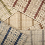 Scattered broadloom samples in windowpane plaid pattern in array of colors. 