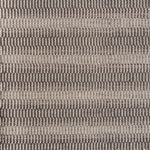 Flatweave rug in a textural stripe in shades of brown.