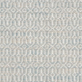 Detail of handwoven rug in an small scale geometric design in white and pale grey-blue