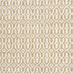 Detail of handwoven rug in an small scale geometric design in beige and white. 