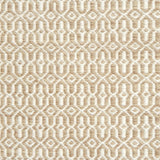 Detail of handwoven rug in an small scale geometric design in beige and white. 